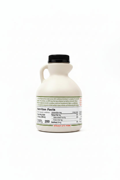 Bottle of maple syrup with nutrition facts label on a white surface
