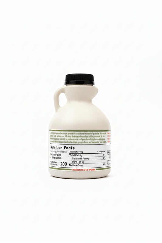 Bottle of maple syrup with nutrition facts label on a white surface