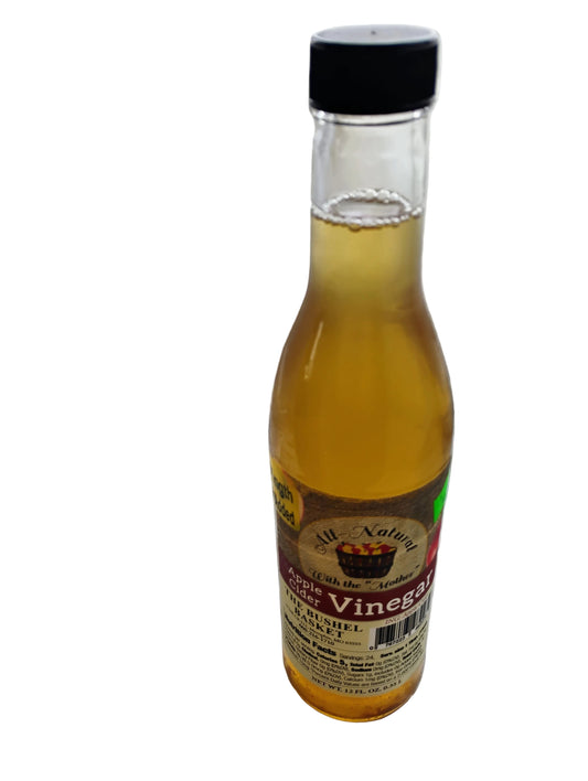 Bottle of apple cider vinegar on a white background