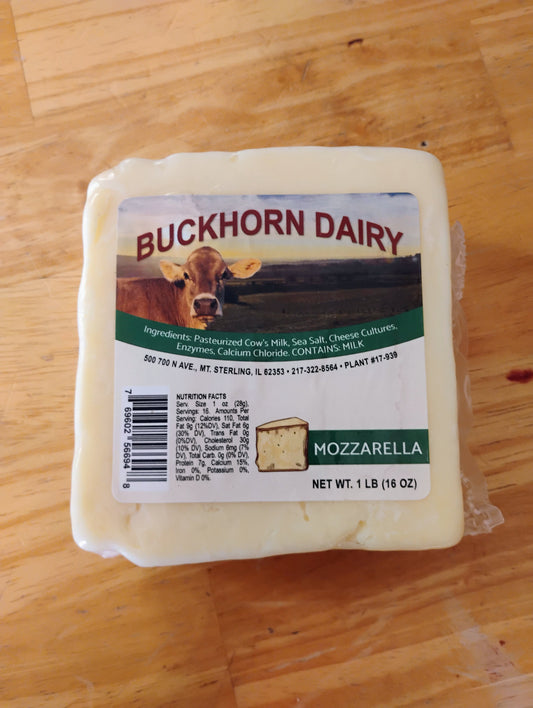 Block of mozzarella cheese with Buckhorn Dairy label on a wooden surface