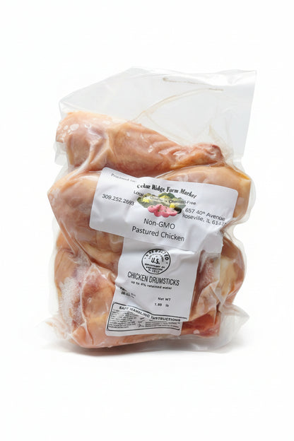 Packaged chicken with a label on a white background