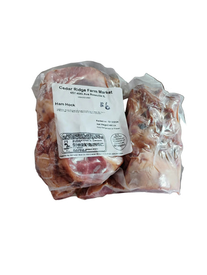 Packaged ham hock from Cedar Ridge Farm Market in a plastic container.