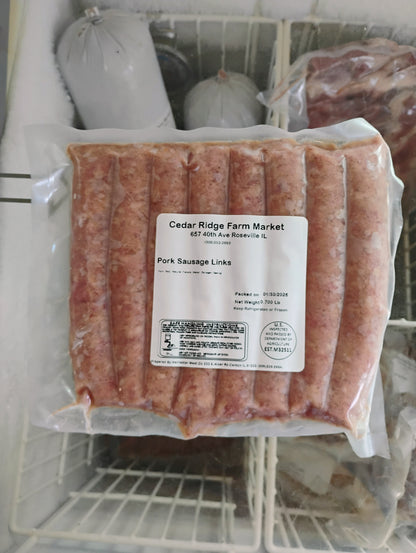 Packaged sausages with a label on a white background