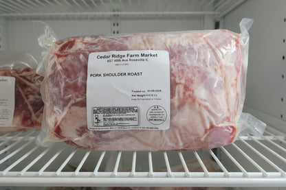 Packaged pork shoulder roast from Cedar Ridge Farm Market in a refrigerator.