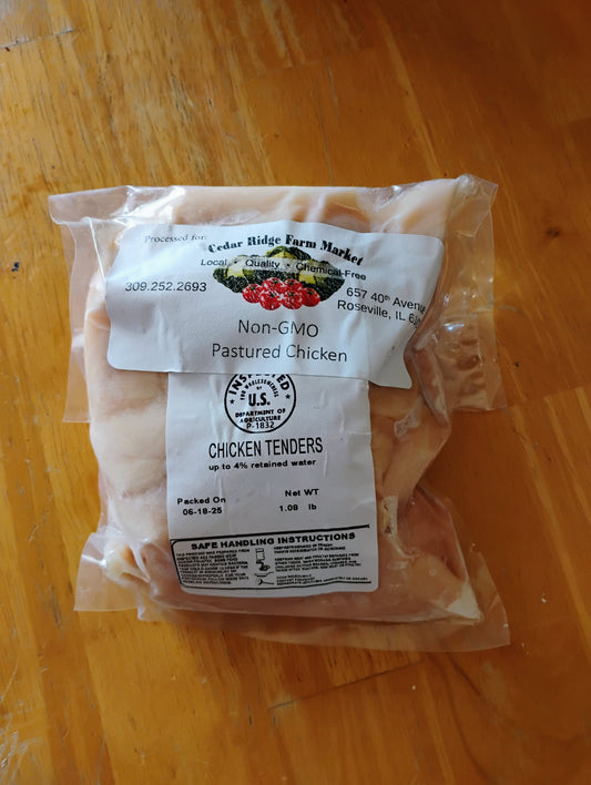 Packaged chicken on a wooden surface with labels