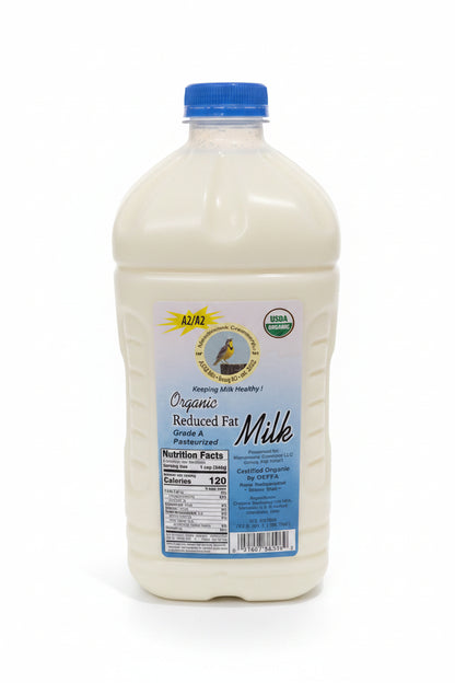 Large container of organic reduced fat milk with a blue cap on a white surface.
